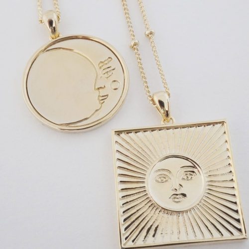 Moon and sun necklaces together