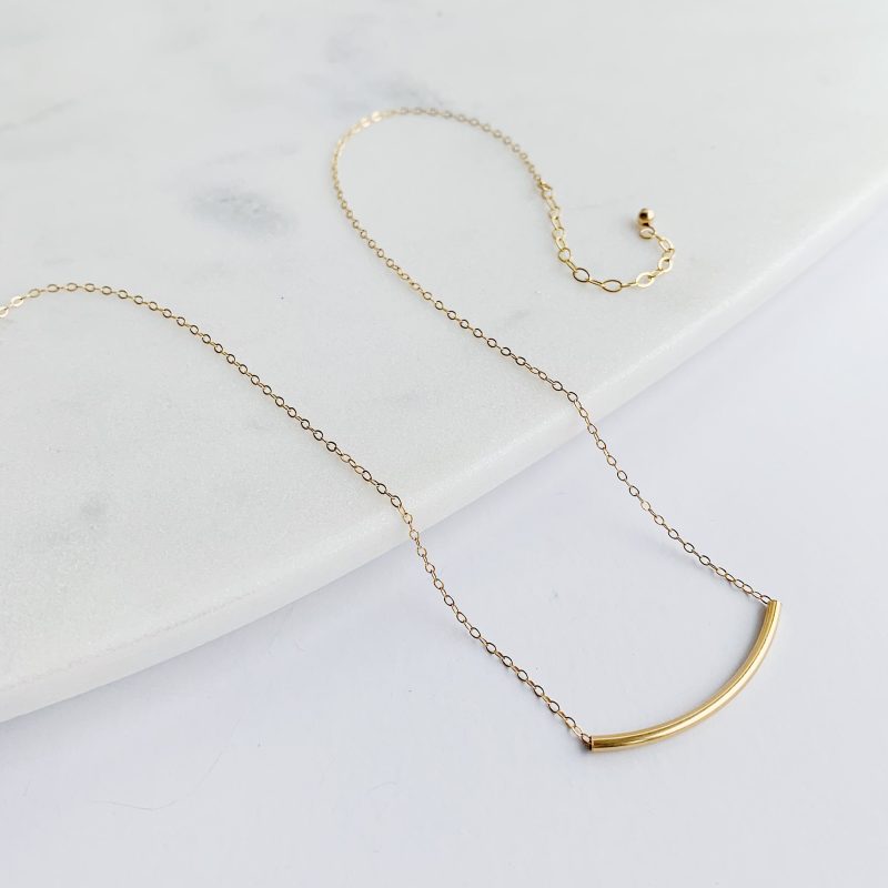 arc necklace gold fill flat lay 2