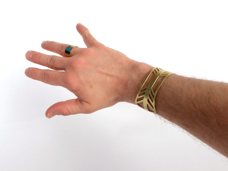 bridge of the gods cuff bracelet on mans arm in brass by portland jewelry designer betsy iya